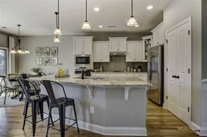 Can a kitchen island be higher than counter?