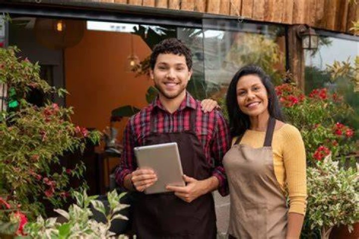 Can permanent residents own a business?