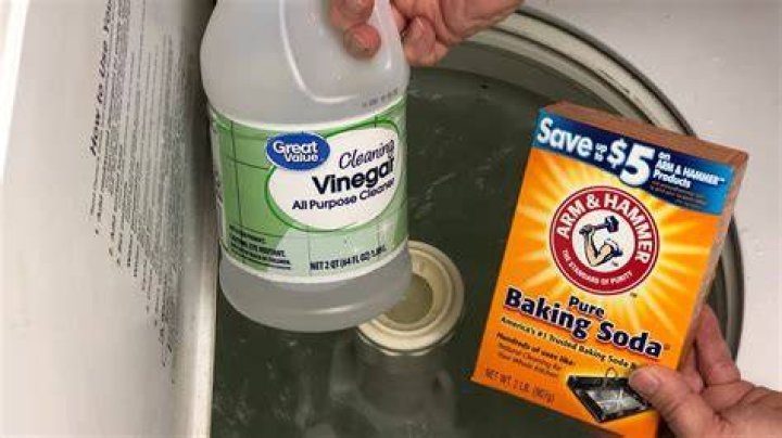 Can you put vinegar and baking soda in washing machine?