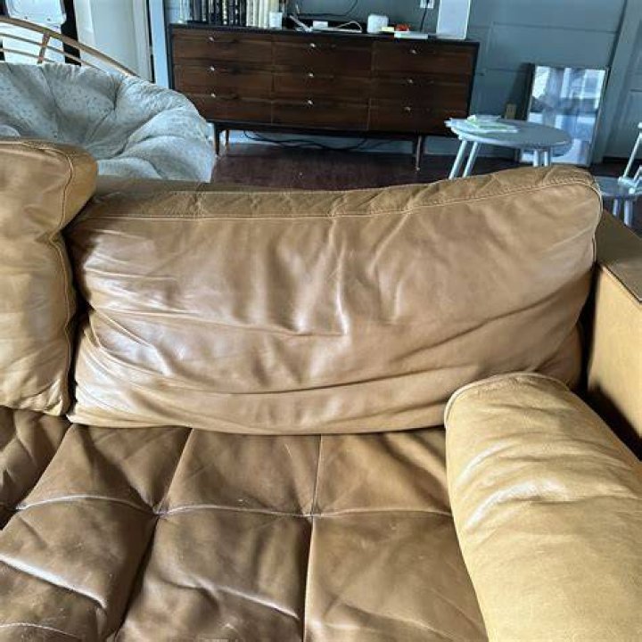 How can I make my leather couch shine again?