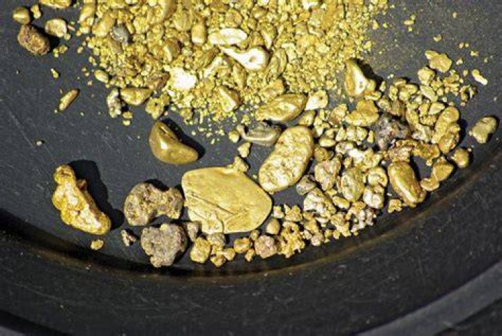 How do gold nuggets form in nature?