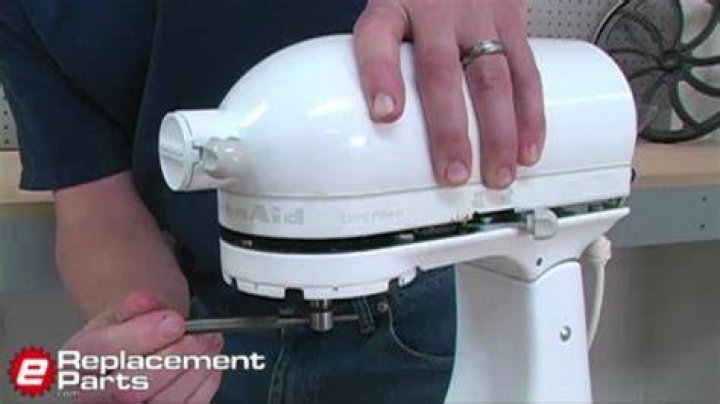 How do I service my KitchenAid Artisan mixer?