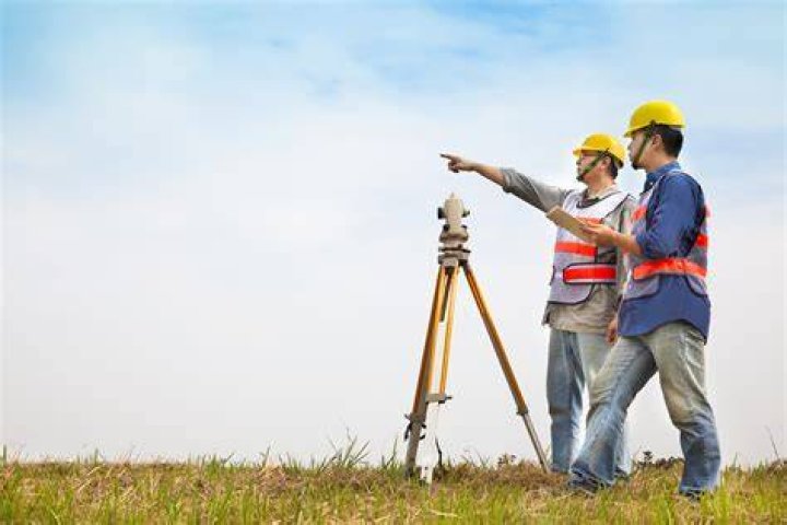 How do I train to be a land surveyor?