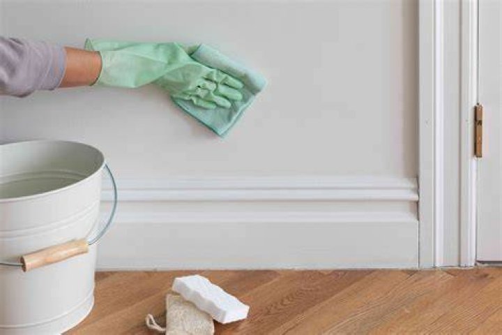 How do you clean white walls without damaging paint?