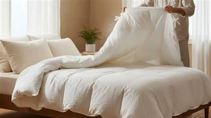 How do you fix a flat down comforter?