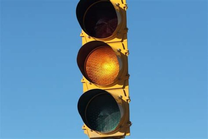 How do you stop at a yellow light?