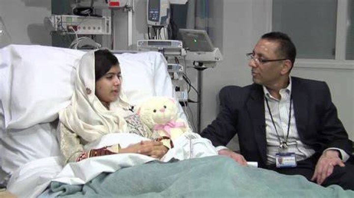 How long was Malala in a coma?