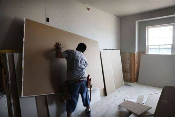 How much do you charge to hang drywall?