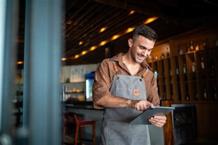 How much is a waiter paid per hour?