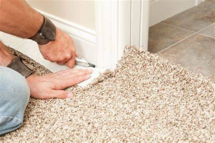 How much space do you leave under baseboard for carpet?