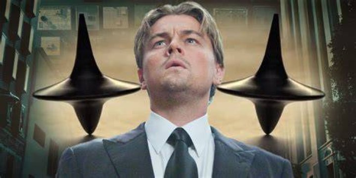 Is Cobb awake at the end of Inception?