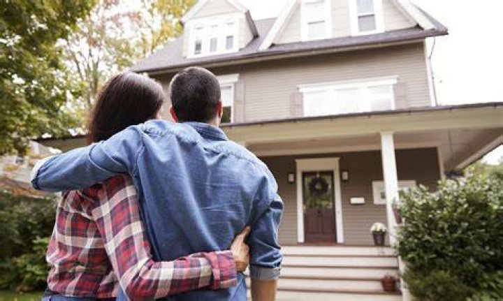Is it better to buy a house on your own or with someone?