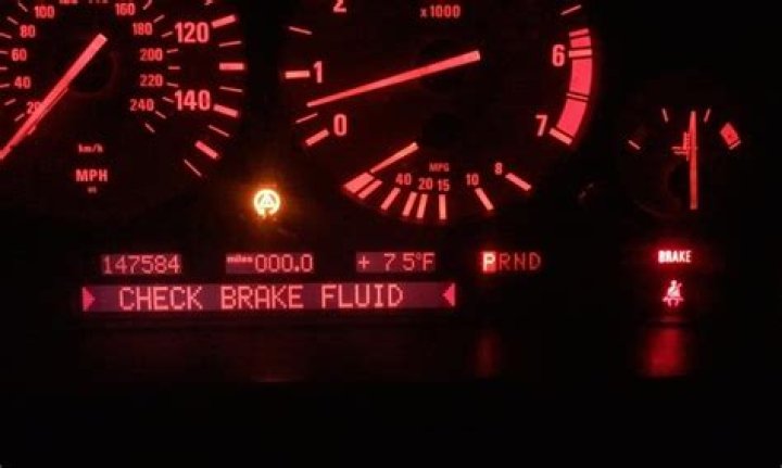 What are signs of low brake fluid?