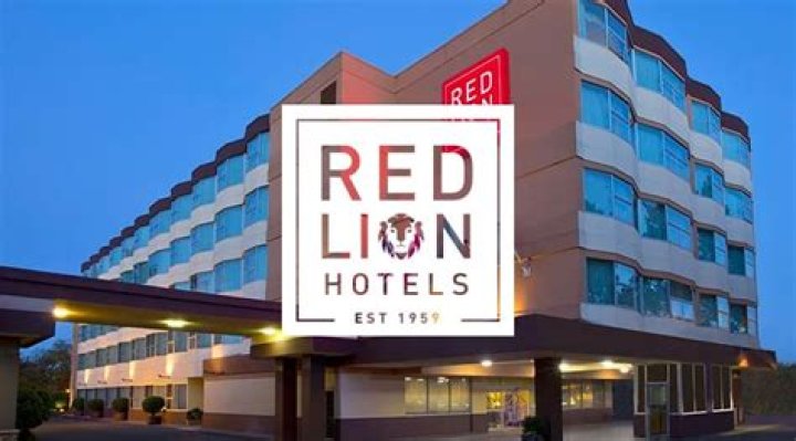 What company owns Red Lion Hotels?