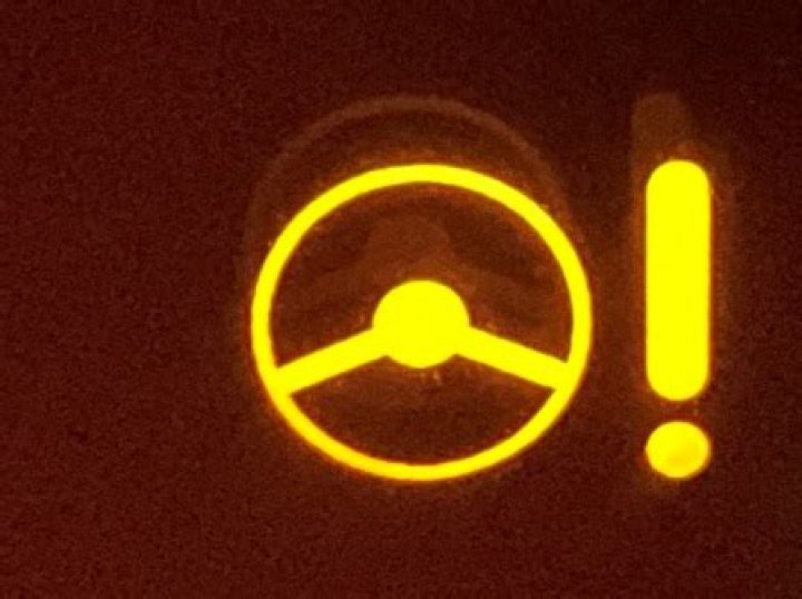 What does the steering wheel light with an exclamation mark mean?