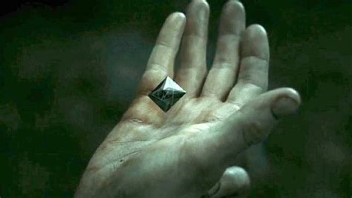 What happens to the resurrection stone after Harry drops it?
