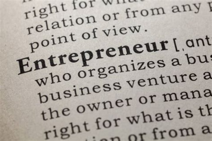 What is the dictionary definition of an entrepreneur?