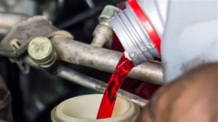 What is the difference between red and clear hydraulic fluid?