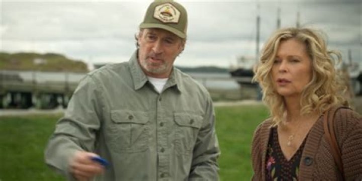 What is the first word that Miss Sullivan spells in Helen's hand?