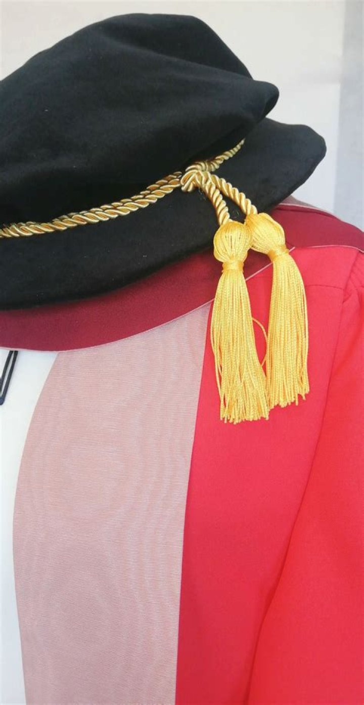 What is the PhD hat called?
