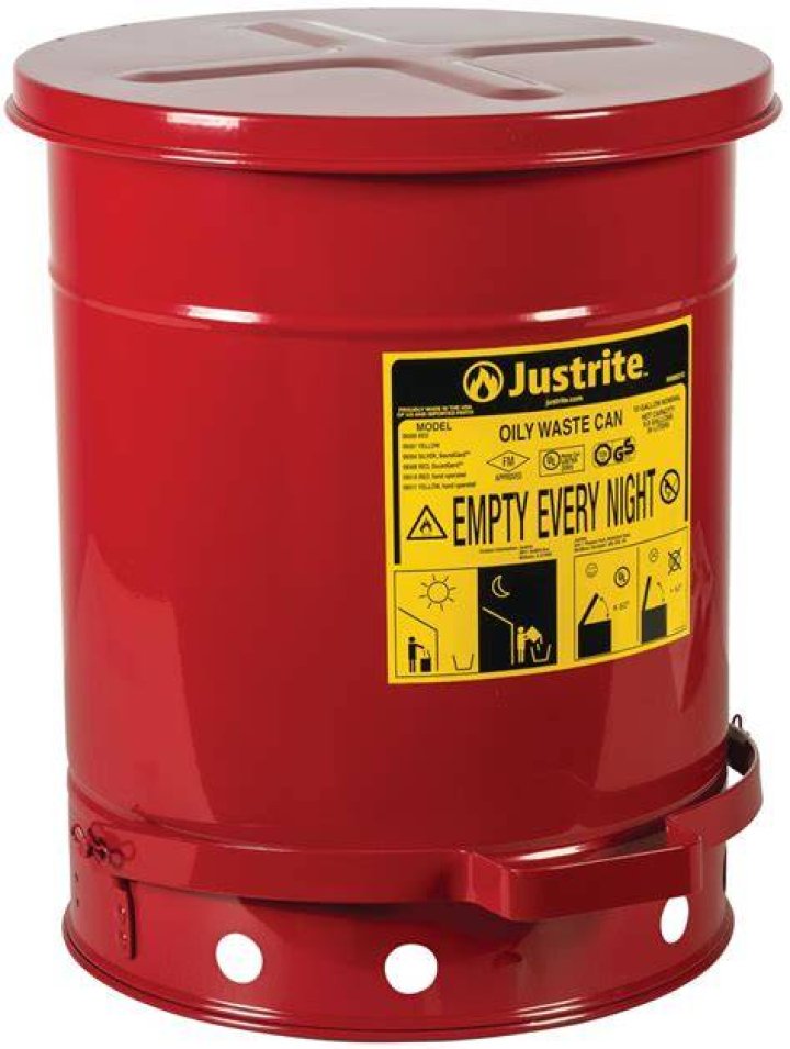What is the proper waste container for a towel or rag soaked in oil?