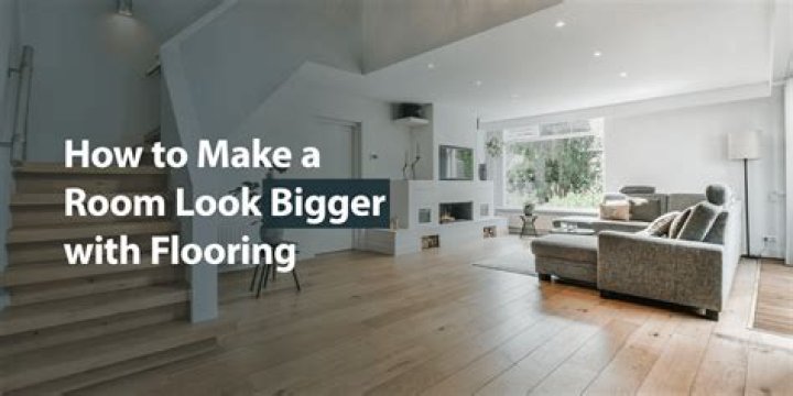 Which way should you lay flooring to make a room look bigger?
