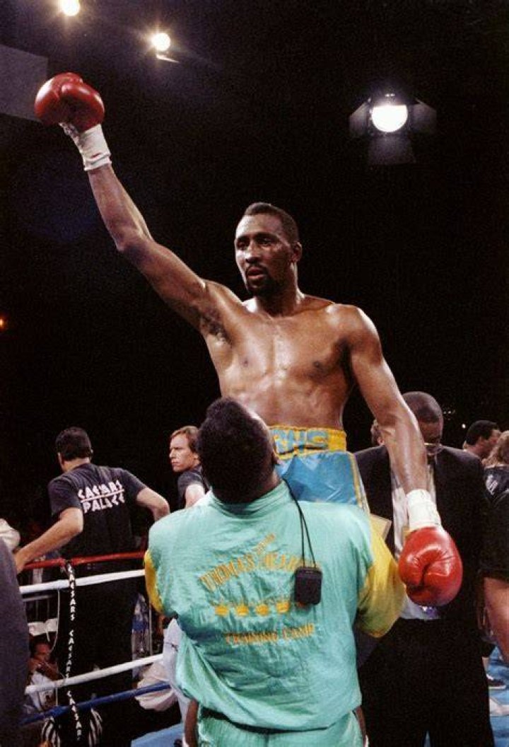 Who was the first boxer to win 5 world titles?
