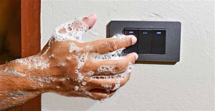 Why a switch should not be touched with wet hands?