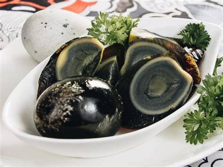 Why are century eggs black?