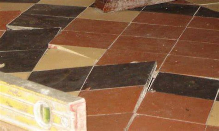 Why are floor tiles lifting?