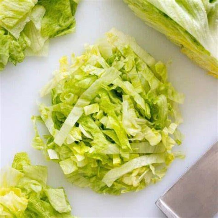 Why do chefs often tear rather than cut up lettuce leaves?