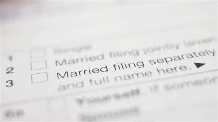 Why do married couples have to file separate tax returns?