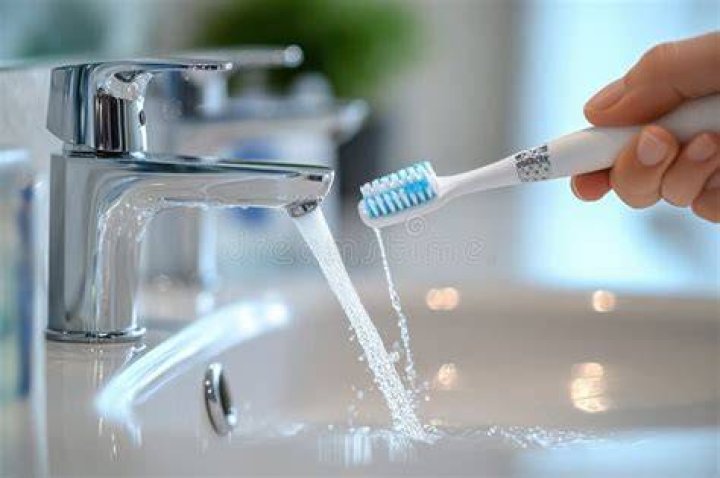 Why do people brush their teeth with the water running?