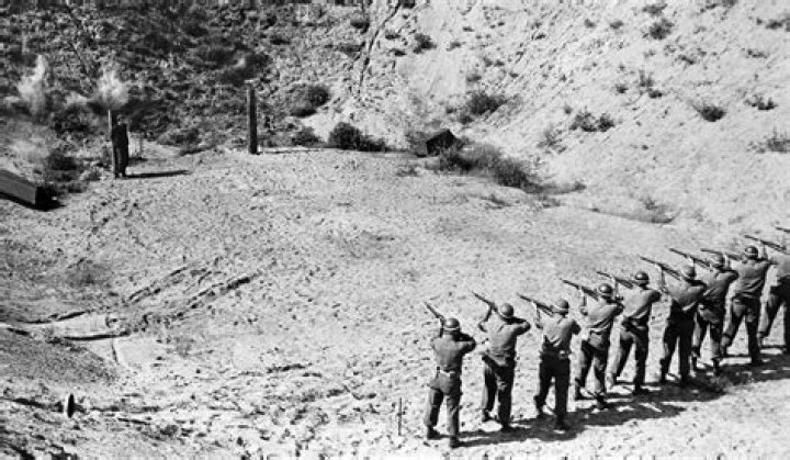 Why does a firing squad have a blank?