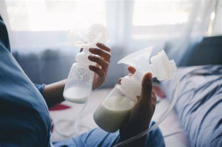 Why does my baby kick and squirm while breastfeeding?